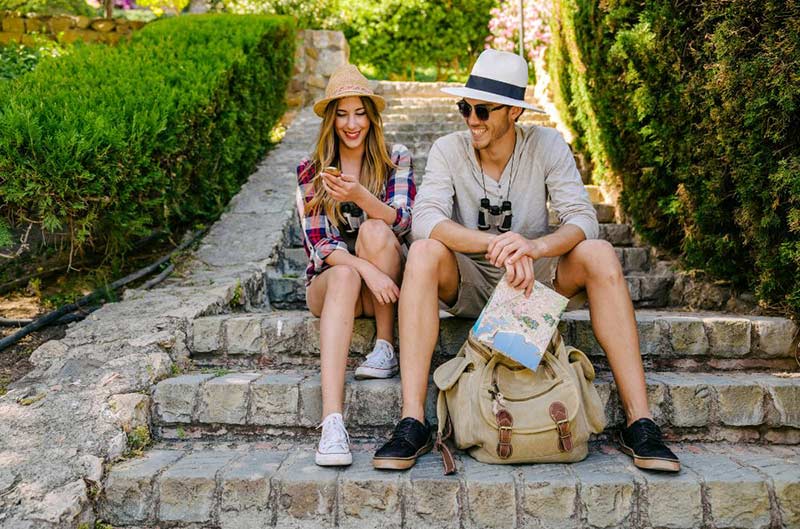 Couple sitting on the stairs enjoying the natural beauty